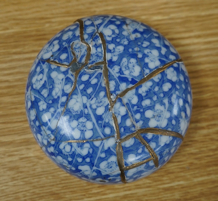 A Japanese Seto blue and white lidded ginger jar, 24cm high. Condition - lid poor (repaired in Kitsugi fashion with staples and filler visible to interior) body fair with one visible star crack.